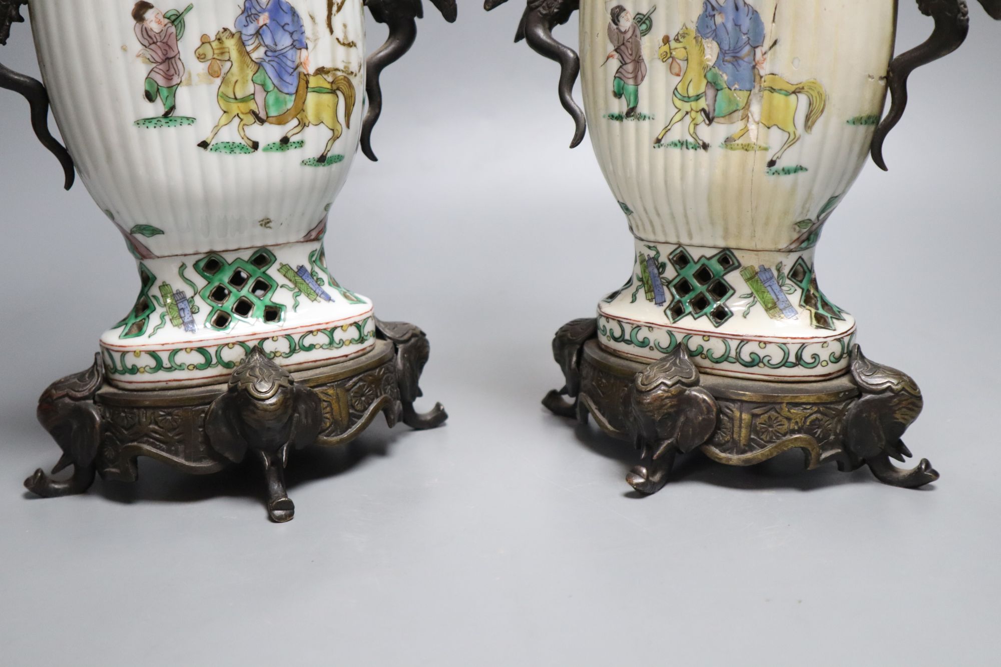 A pair of Chinese famille verte vases converted to candelabra, height 41cm